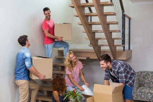 Commercial moving team working in a Highams Park business premises