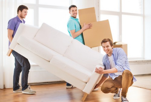 Loading furniture and boxes into a removal van