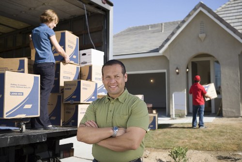 Family home moving day with removal truck access and loading preparations
