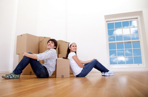 Office furniture and boxed equipment prepared for a move in Highams Park