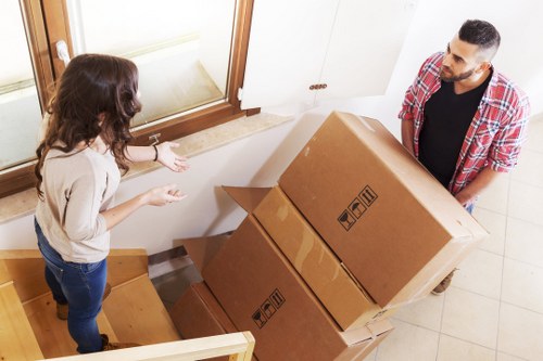 Unpacking boxes and organising rooms in a new Highams Park property