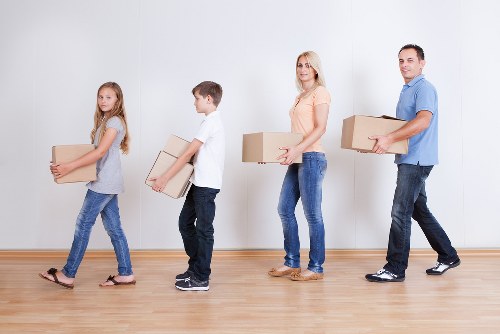 Local moving team loading boxes and furniture for a property move