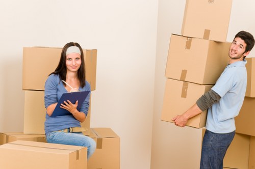 Professional movers loading furniture and household items